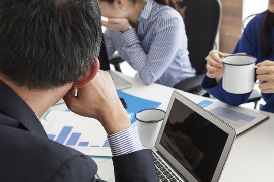 Men and women in a meeting