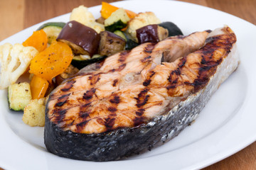salmon fish steak meal with vegetables