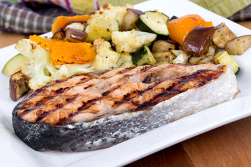 salmon fish steak meal with vegetables