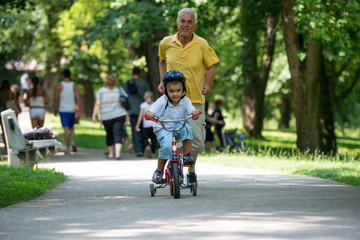 grandfather and child have fun  in park