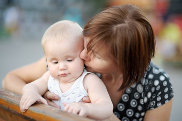 Beautiful middle aged woman and her adorable little grandson