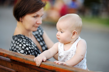 Fototapeta premium Beautiful middle aged woman and her adorable little grandson