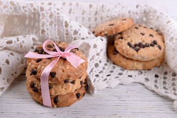 Tasty cookies on color wooden background