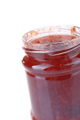 Homemade jar of strawberry jam isolated on white background