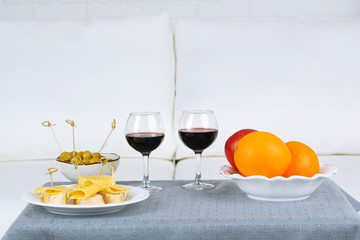 Table at home with food and drinks for friends