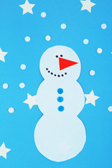 Handmade snowman on bright background