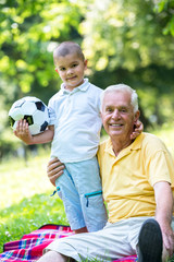 grandfather and child have fun  in park