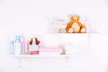 Fototapeta na wymiar Baby accessories on shelves close-up