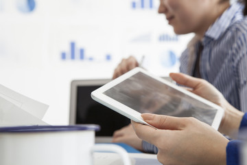 Woman looking at the electronic tablet