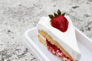 strawberry cheese cake with cream on top
