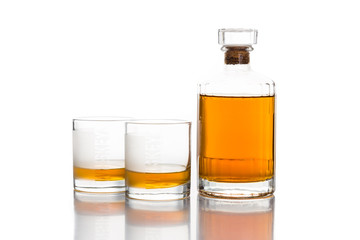 Two whiskey on neat, with a whiskey bottle