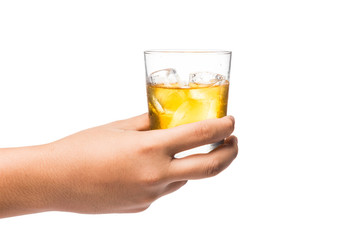 Hand holding a glass of whiskey on the rocks