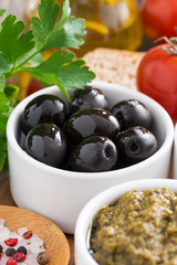 olives, pesto, fresh vegetables and ciabatta, close-up