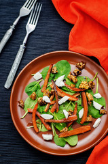 salad with spinach, mozzarella, walnuts and caramelized carrots.