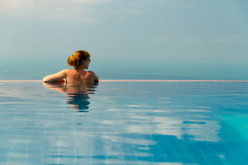 girl with glasses in the swimming pool