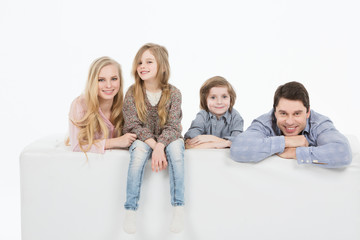 Obraz premium A happy family with two children at home.