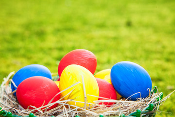 Colorful easter eggs lying in basket