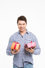 Man smiling and holding gifts on the hands