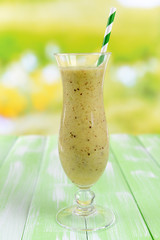 Delicious berry cocktail on table on bright background