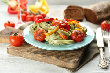 Tasty pasta with pepper, carrot and tomatoes