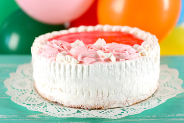 Delicious cake on table  bright background