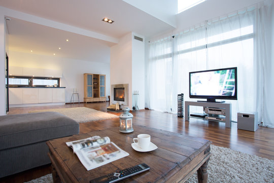 Spacious and bright living room with tv