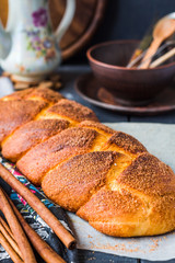 large wicker buns with cinnamon and golden brown