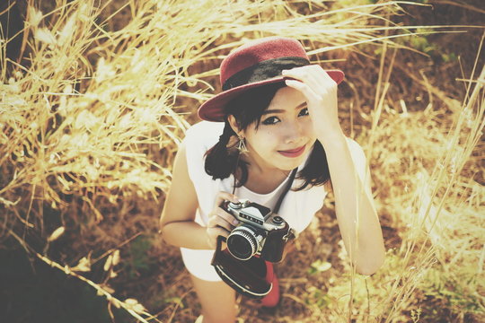 Asian girl with retro camera classic film