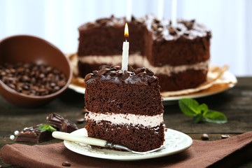 Delicious chocolate cake on table on light background