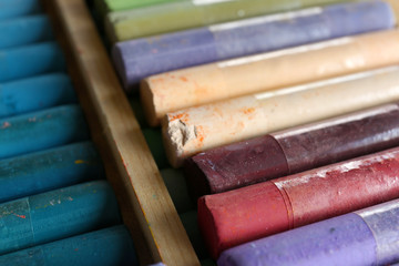 Colorful chalk pastels in box close up