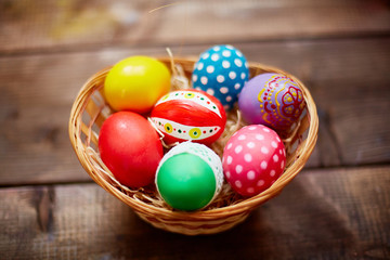 Fototapeta na wymiar Basket with painted eggs