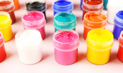 Colorful paint on pink background