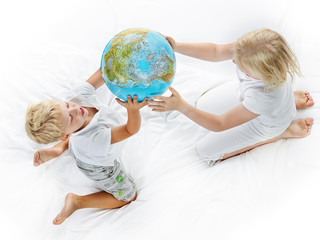 Kids play with world ball