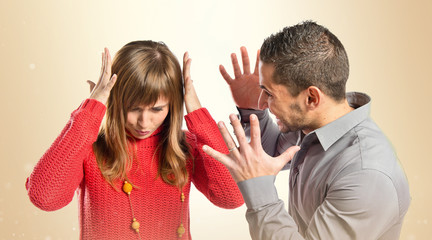 Businessman screaming at his girlfriend over white background