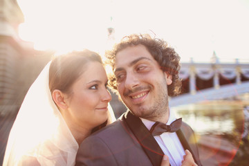 Close up of a bride and groom in the sunlight