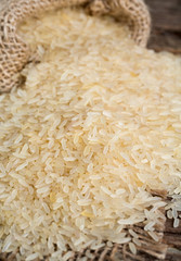 parboiled rice on wooden surface