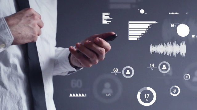 Businessman performing business data analysis on mobile phone