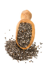 chia seeds in a wooden scoop isolated on white