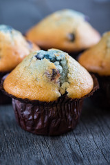 Blueberry muffins on wooden table