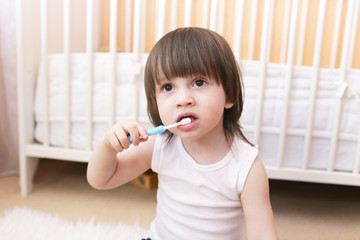 lovely little boy age of 2 years cleans teeth