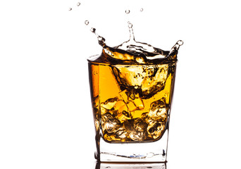 water splash in glass isolated on white