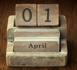 A very old wooden vintage calendar showing the date 1st April on