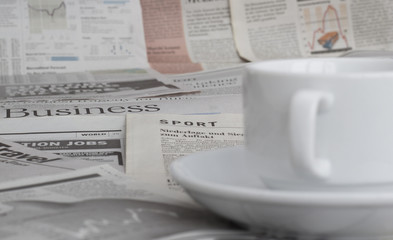 Newspapers and coffee