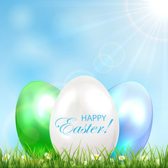 Three Easter eggs in a grass