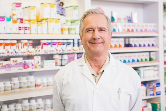 Smiling Senior Pharmacist Standing