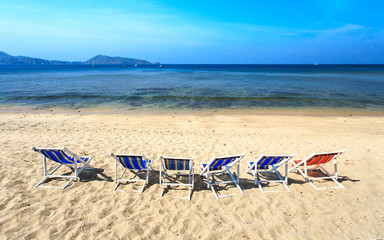 Fototapeta na wymiar sun loungers stand at the beach in Phuket, Thailand