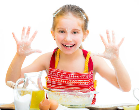 cute little girl baking on kitchen
