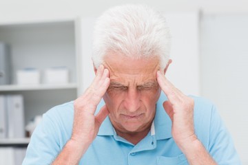Senior patient suffering from headache