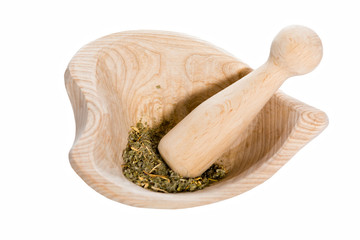 Mortar and dried herbs, isolated on white
