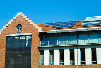 Solar panels on the roof of a large building